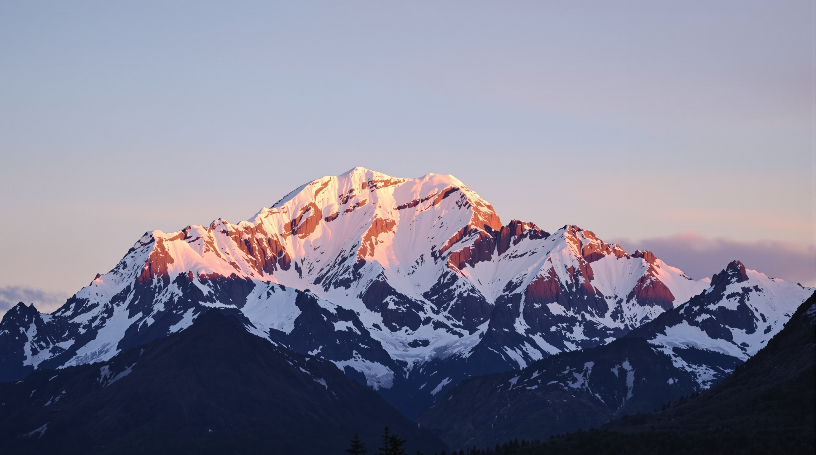a majestic snow-capped mountain peak bathed in a warm glow of the setting sun